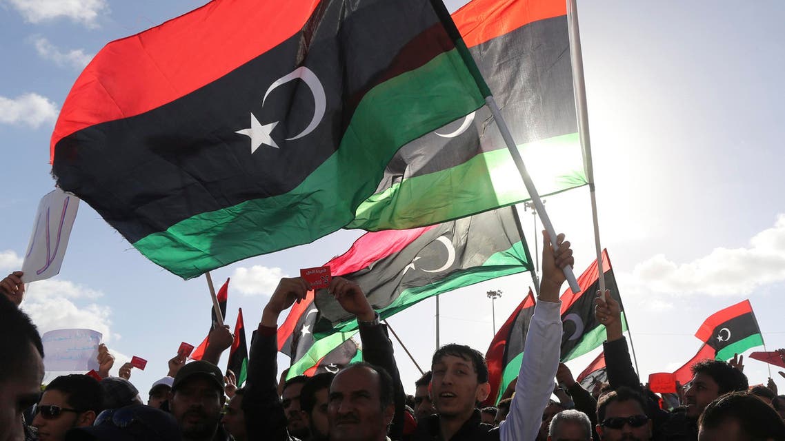 People wave Libyan flags during a demonstration in Benghazi, Feb. 7, 2014. (Reuters)