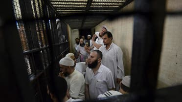 Militant Islamists react during their verdict at a court in Ismailia city, about 120 km (75 miles) outside of Cairo Sept. 24, 2012. (Reuters)