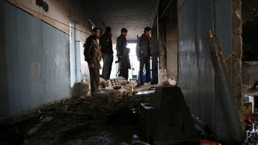FSA fighters inspect damage from suicide bombers belonging to the ISIS in Aleppo January 12, 2014. (Reuters)