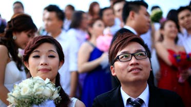 Love birds tie the knot in Malaysia mass wedding