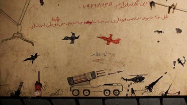 Graffiti left behind by Taliban fighters remains on the walls of a compound now used as a command center for the U.S Marine Corps's First Battalion reut
