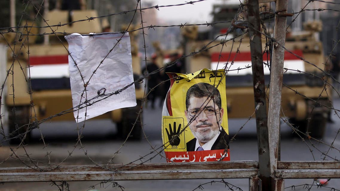 A poster of ousted Egyptian President Mohamed Mursi is pictured on barbed wires during a protest Reuters