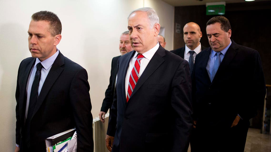 Israel's Prime Minister Benjamin Netanyahu (C) arrives to chair the weekly cabinet meeting on Feb. 16, 2014 in Jerusalem. (AFP)