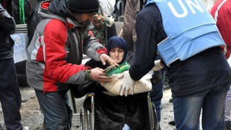 U.N. says aid workers deliver food to Damascus district