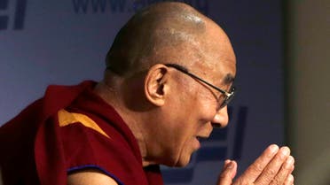 The Dalai Lama greets the audience before addressing the American Enterprise Institute in Washington, Feb. 20, 2014. (Reuters)