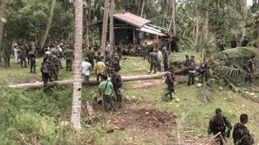 Filipino soldiers gather at a seized camp of Abu Sayyaf militants on Jolo island in southern Philippines September 21, 2009