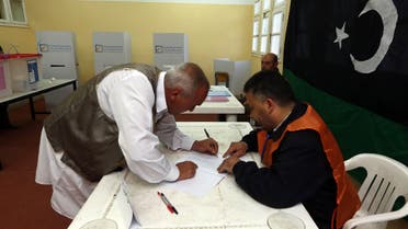 A Libyan man casts his vote to elect a constituent assembly at a polling station in the capital Tripoli on Feb. 20, 2014. (AFP)