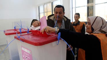 A man casts his ballot during a vote to elect a constitution-drafting panel in Benghazi February 20, 2014.  Reuters