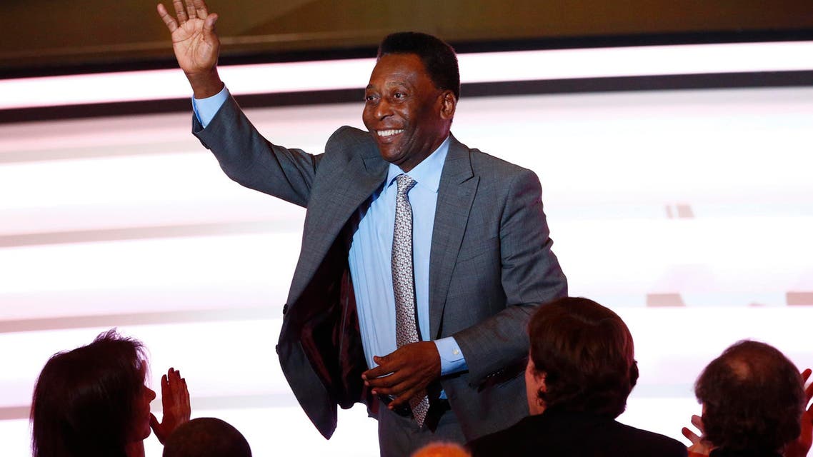 Brazilian soccer legend Pele waves to the audience during the Men's World Soccer Player of the Year 2013 Award at the FIFA Ballon d'Or ceremony in Zurich January 13, 2014. REUTERS/Ruben Sprich