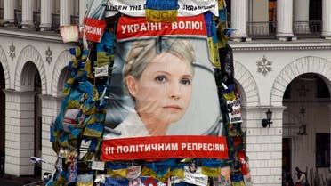 A poster showing jailed Ukrainian opposition leader Yulia Tymoshenko is seen in the Independence Square in Kiev, Feb. 22, 2014. (Reuters)