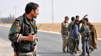 Syrian Kurds claim town from Islamists