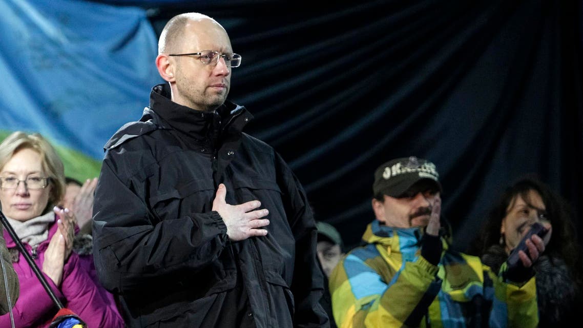 Former economy minister Arseny Yatseniuk (front) stands on the stage during a rally in Independence Square in Kiev, February 26, 2014. Reuters