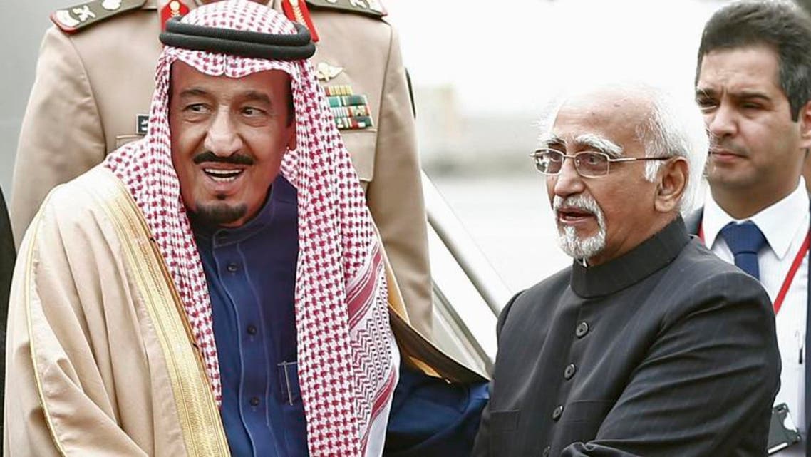 Saudi Arabia's Crown Prince Salman bin Abdul Aziz al-Saud (L) shakes hands with India's Vice President Hamid Ansari upon his arrival at the airport in New Delhi. (Reuters)