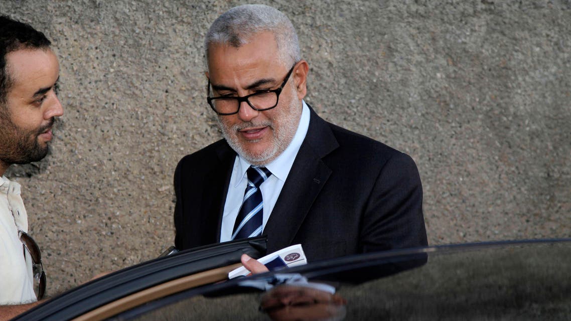 Moroccan Prime Minister Abdelilah Benkirane (R) speaks with a Reuters journalist in Rabat, July 29, 2013. (Reuters)