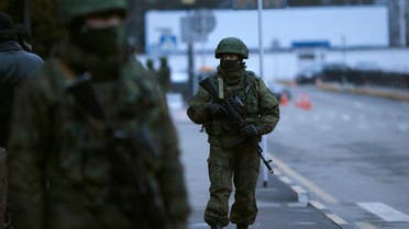 Armed men patrol at the airport in Simferopol, Crimea Feb. 28, 2014. (Reuters)