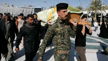 Mourners carry the coffin of their relative, who was killed in an attack in Baghdad, during a funeral in Kerbala, about 80 km southwest of Baghdad, Feb. 28, 2014. (Reuters)               
