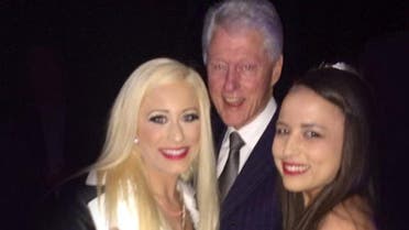 Michelle Obama Fucking Bill Clinton - Bill Clinton poses with 'prostitutes' at charity event | Al Arabiya English