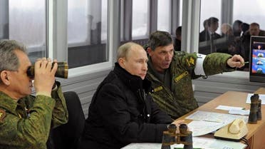 Russia's President Vladimir Putin (C) watched military exercises at the Kirillovsky firing ground in the Leningrad region, March 3, 2014. (Reuters) 