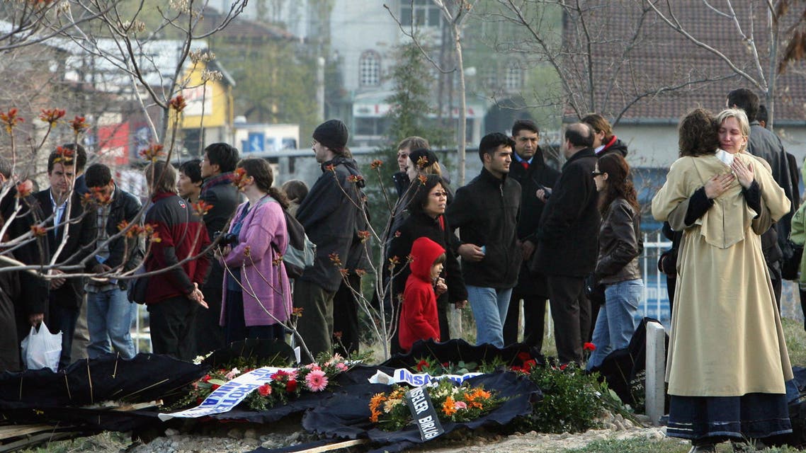 Mourners console one another after the funeral of Tilmann Geske, who was killed in an attack on a publishing house in Turkey's southeastern province of Malatya, at the cemetery in Malatya April 20 2007. Reuters