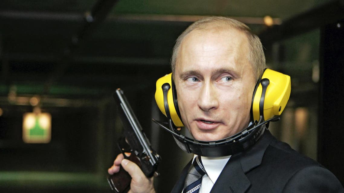 Back in time: Russian President Vladimir Putin stands with a gun at a shooting gallery in Moscow November 8, 2006. (Reuters)
