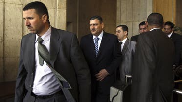 Former Syrian Prime Minister Riyad Hijab (2nd L) leaves the Egytian Foreign ministry after meeting Egyptian Foreign Minister Mohamed Kamel Amr in Cairo February 11, 2013. 
