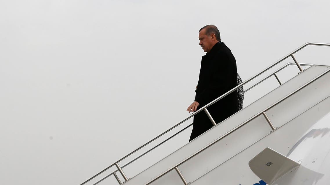 Turkey's Prime Minister Tayyip Erdogan steps off from his plane as he arrives in Elazig for an election rally of his ruling AK Party, March 6, 2014. (Reuters)
