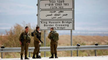 Israeli soldiers stand guard near the entrance to Allenby Bridge, a crossing point between Jordan and the occupied West Bank, reuters