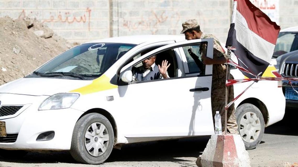 Security forces conduct a car search at a checkpoint on a street in Sanaa January 18, 2014 Reuters