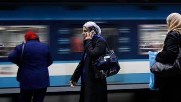 A woman speaks on the phone at a metro station in Cairo on Feb. 14, 2011. (File photo: Reuters)