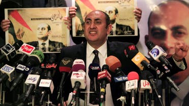 Egypt's leftist activist and labor rights lawyer Khaled Ali gestures during a news conference in Cairo, March 16, 2014. Reuters