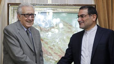 UN-Arab League Special Envoy for Syria Lakhdar Brahimi (L) shakes hands with Iranian secretary of the Supreme National Security Council, Ali Shamkhani in Tehran on March 16, 2014. (AFP)