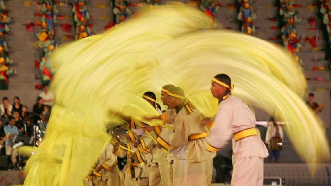 Dancers perform Malaysian traditional dance during a full dress rehearsal for the Colors of Malaysia 2005 parade in Kuala Lumpur. (Reuters)