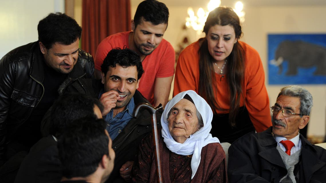 Sabria Khalaf (C), 107 years old Syrian refugee, is pictured at her family house in Holdorf, Germany, on March 17, 2014. Khalaf was welcomed by family members who are already living in Germany. (AFP)