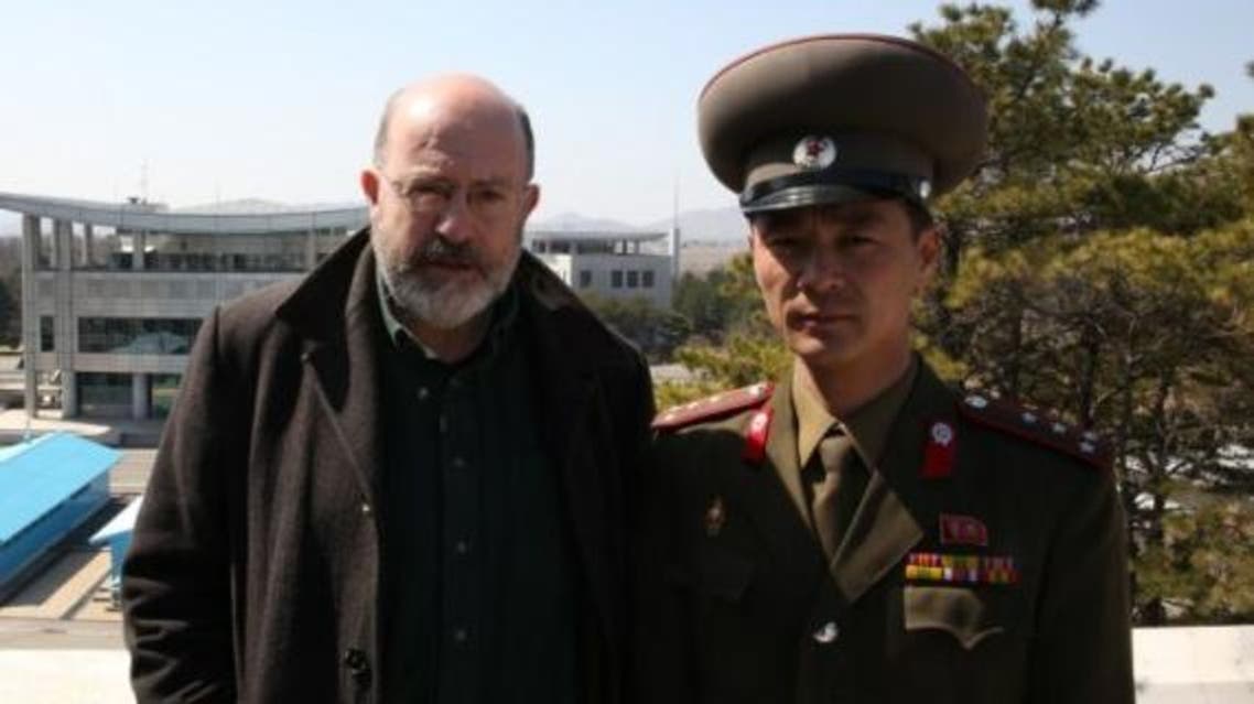The BBC’s John Sweeney poses with a North Korean soldier. (Image courtesy: BBC)