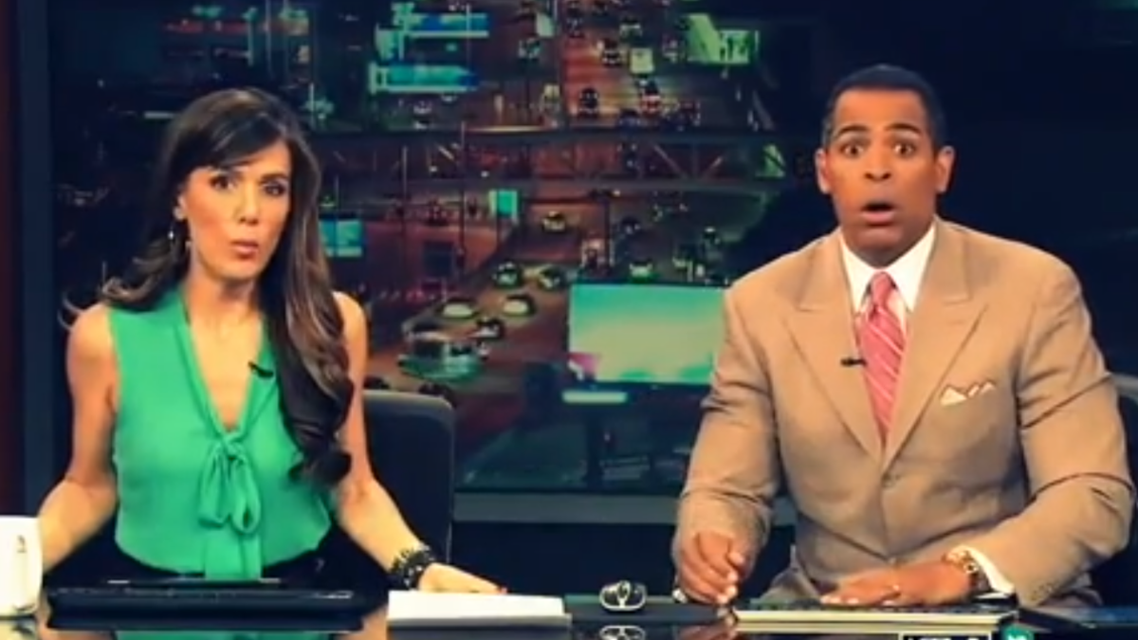 Anchors Chris Schauble and Megan Henderson hid under their desk during Monday's quake. (Image courtesy: KTLA-TV)