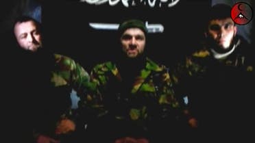 An undated still image taken from video shows the address of Chechen rebels, led by Emir of the Caucasus Doku Umarov (C). (Reuters)