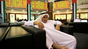 A broker sleeps at the Dubai Financial Market, Dec. 23, 2009.  (File photo Reuters)