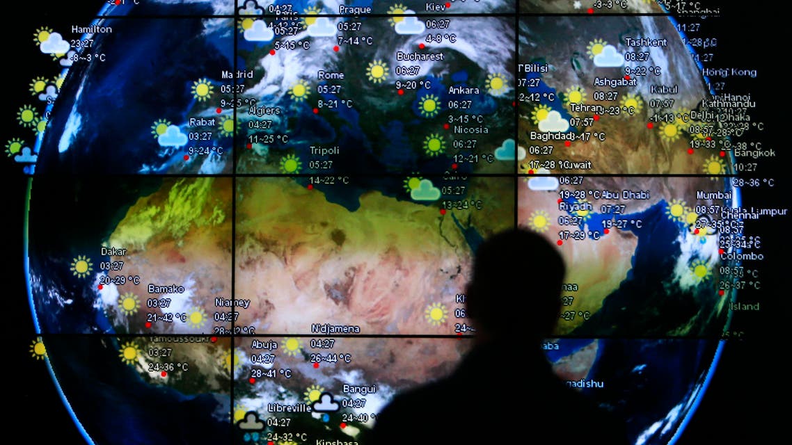 A visitor looks at a screen showing weather updates at the Kuala Lumpur International Airport in Sepang March 18, 2014. (Reuters)