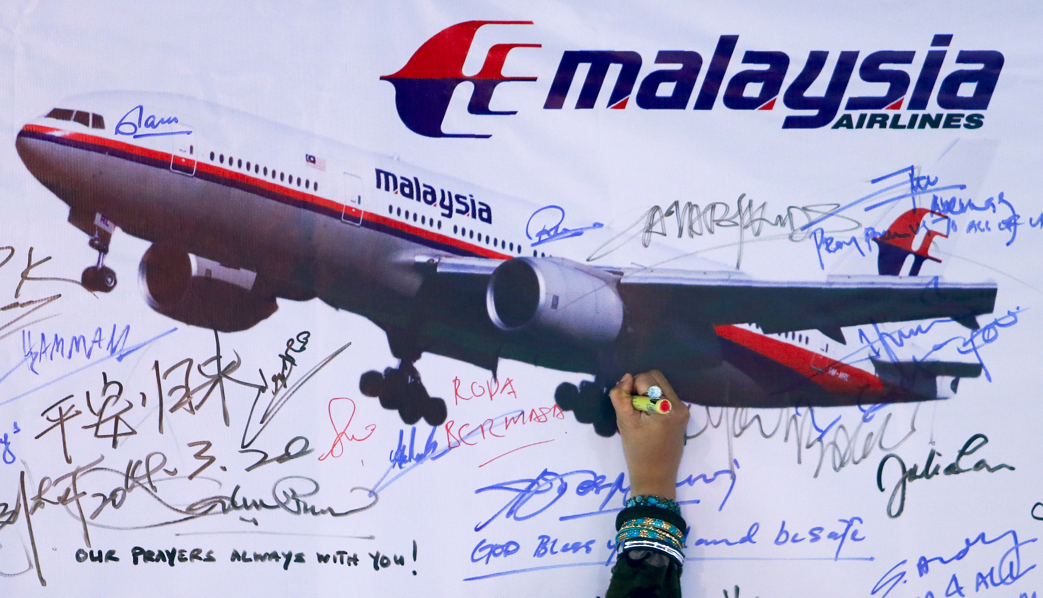 A board for passengers onboard missing Malaysia Airlines Flight MH370 and their family members. (Reuters)