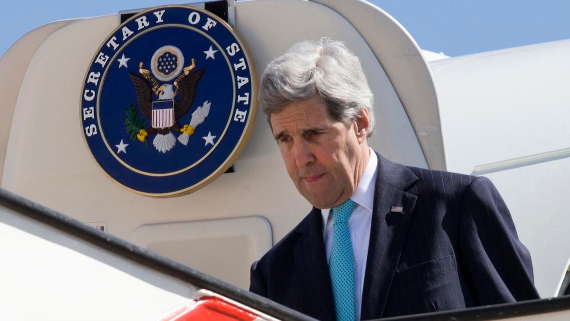 U.S. Secretary of State John Kerry leaves his plane as he arrives in Amman March 26, 2014. (AFP)