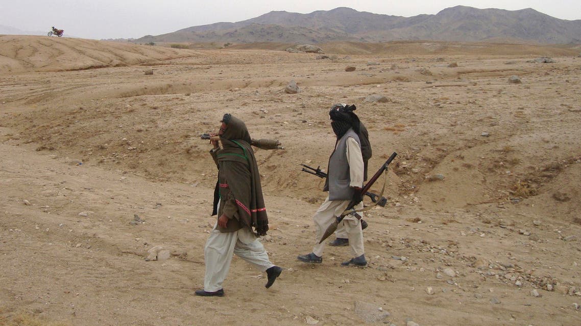Taliban fighters walk with their weapons at an undisclosed location in Afghanistan Oct. 30, 2009. (File: Reuters)