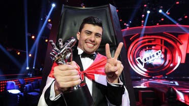  Sattar Saad from Iraq poses with his trophy flashing the sign of victory after he was named the winner afp