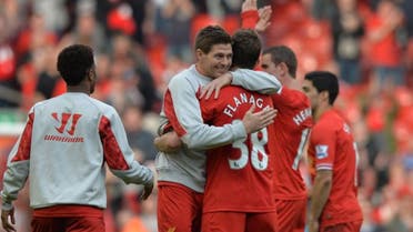  Liverpool’s English midfielder Steven Gerrard (L) embraces Liverpool’s English defender Jon Flanagan (R) after Liverpool’s victory in the English Premier League football match between Liverpool and Tottenham Hotspur at Anfield in Liverpool, northwest England on March 30, 2014. (Reuters)