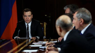 Russian Prime Minister Dmitry Medvedev (L) chairs a meeting with his deputies. (File photo: Reuters)