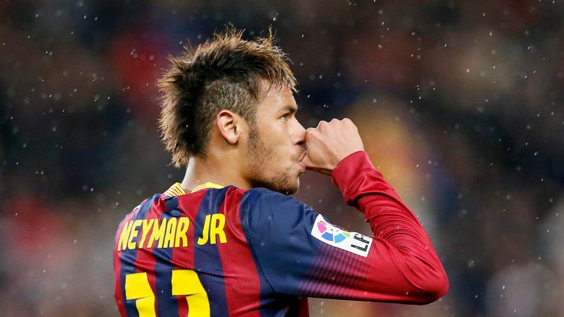 Barcelona's Neymar celebrates his second goal against Celta de Vigo during their La Liga's soccer match at Nou Camp stadium in Barcelona March 26, 2014. (Reuters)
