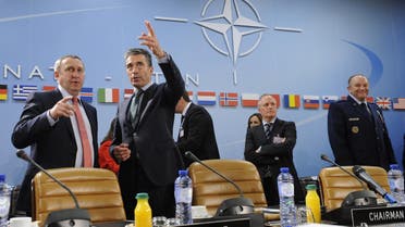 Ukraine Foreign Affairs minister Andrii Deshchytsia (L) speaks with NATO Secretary General Anders Fogh Rasmussen (2ndL) during the Nato-Ukraine Foreign Affairs meeting at the NATO headquarters in Brussels on April, 01 2014. (AFP)