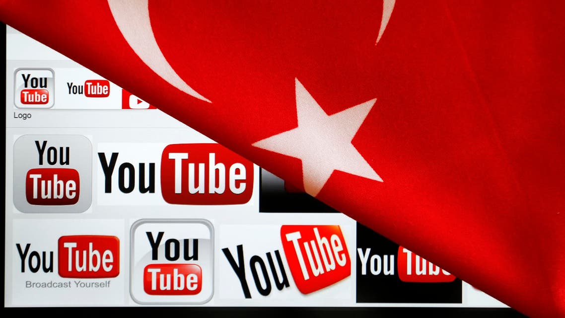 YouTube logos displayed on a laptop screen partially covered with Turkey's national flag in this photo illustration taken in Ankara March 27, 2014.