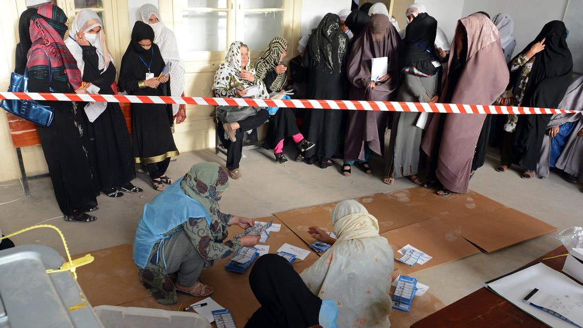 Afghan election officials count ballot papers at the end of polling in Kandahar on April 5, 2014. (AFP)