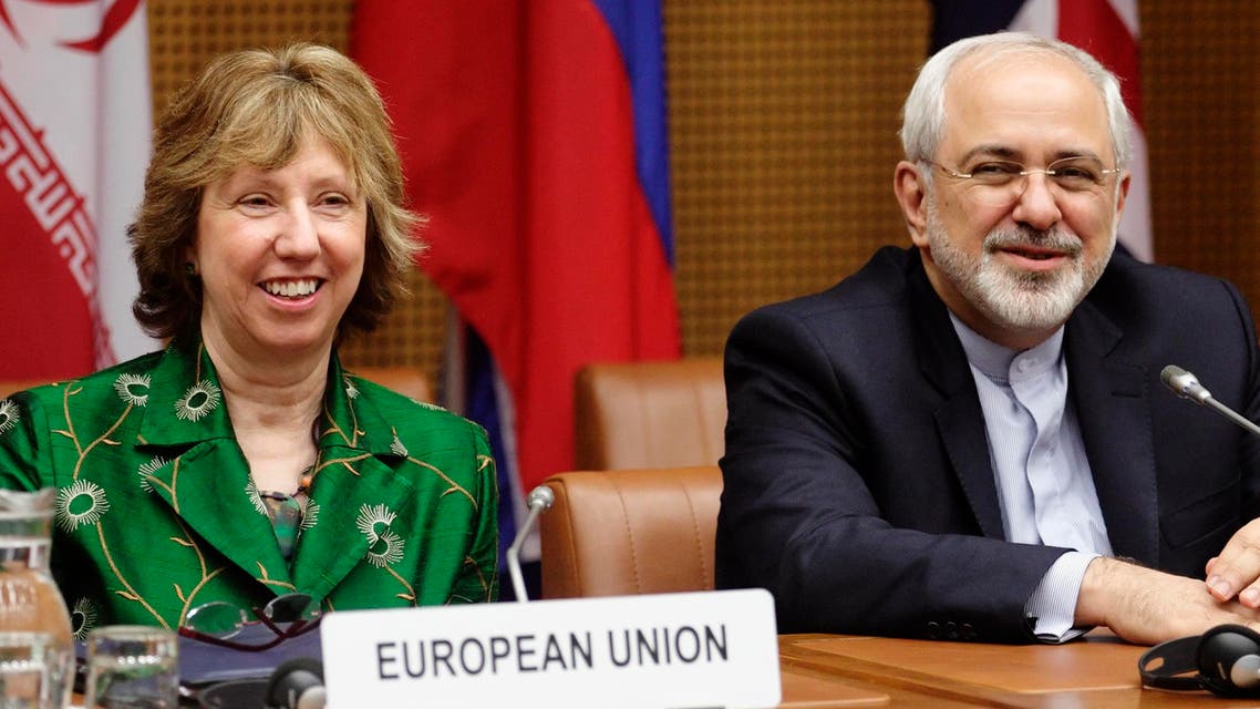 European Union foreign policy chief Catherine Ashton (L) and Iranian Foreign Minister Mohammad Javad Zarif smile at the start of talks in Vienna April 8, 2014. Reuters