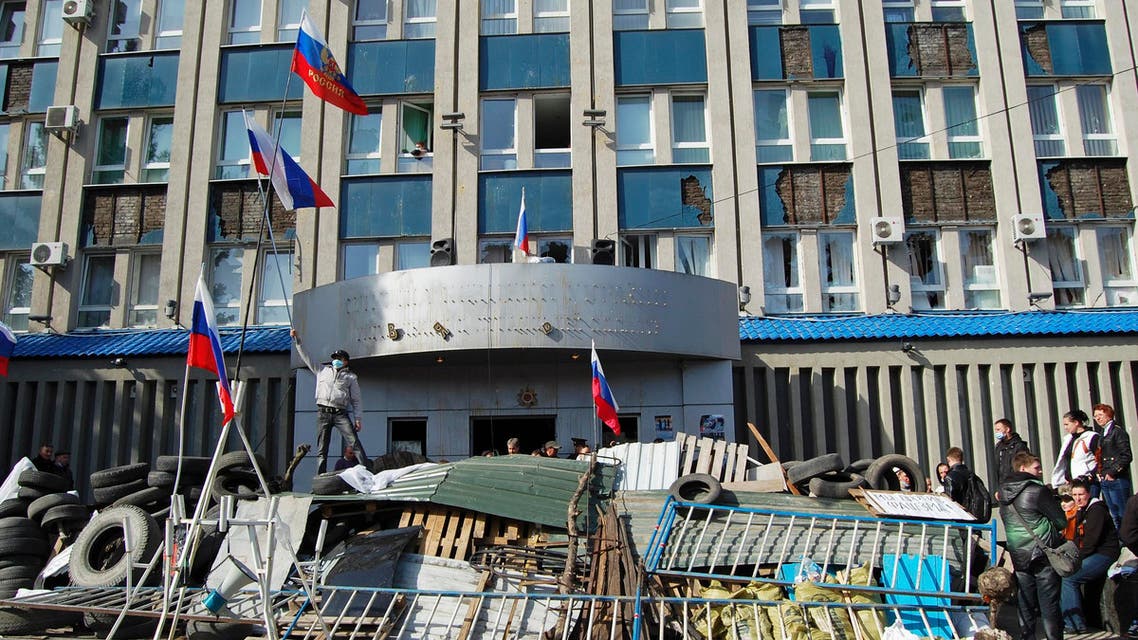 Pro-Russian protesters gather at a barricade outside the offices of the SBU state security service in Luhansk, in eastern Ukraine April 7, 2014. (Reuters)